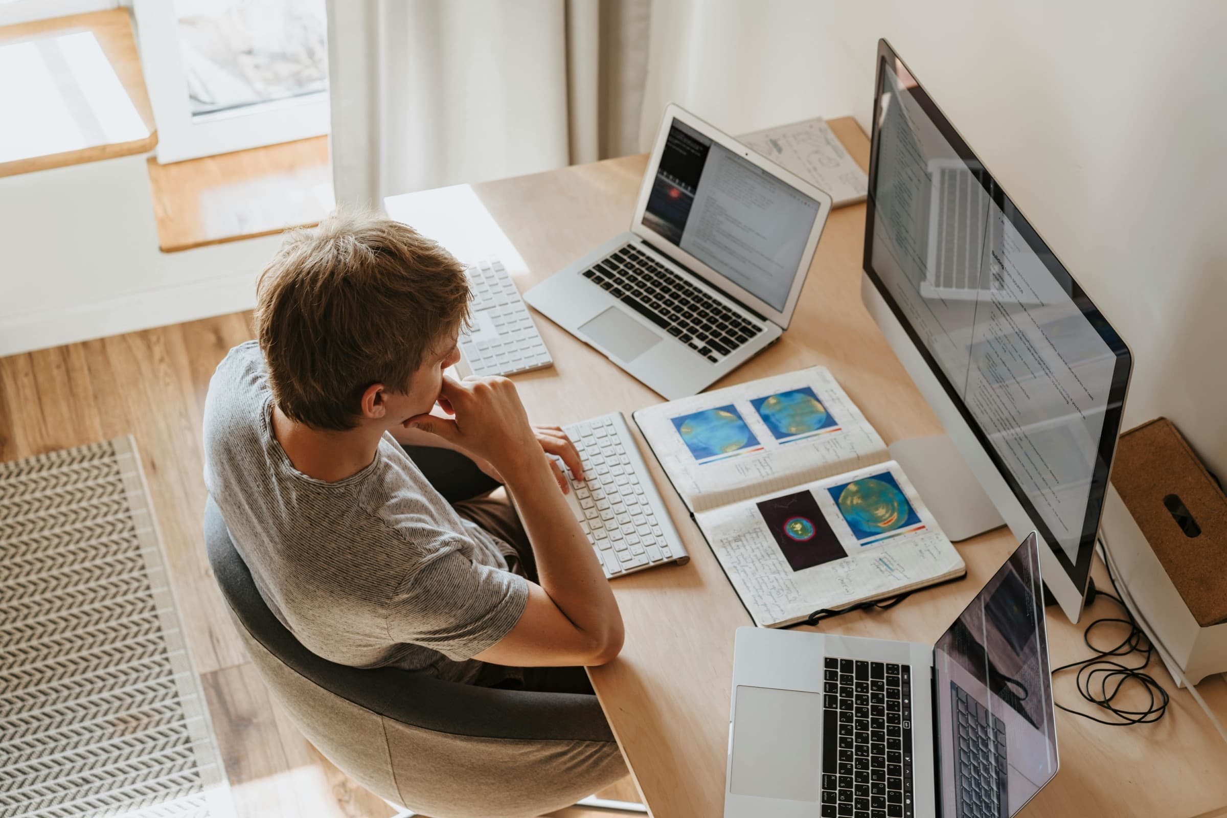 A learner working on a laptop